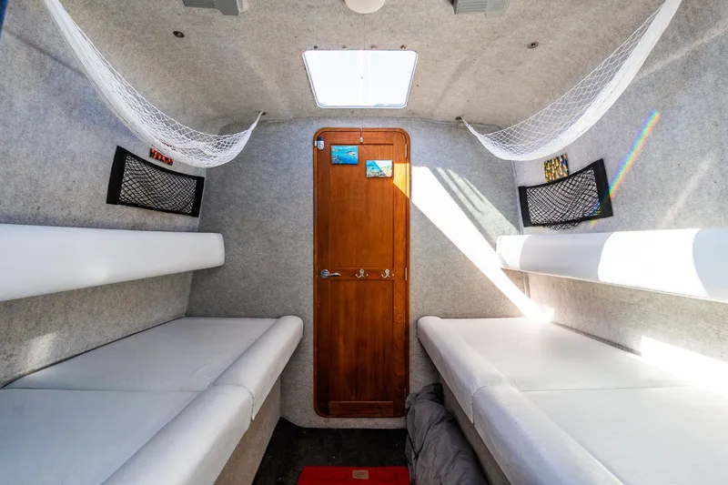 Slide: The Image of Interior of 2008 Protector 410 Targa with white seating. - 28