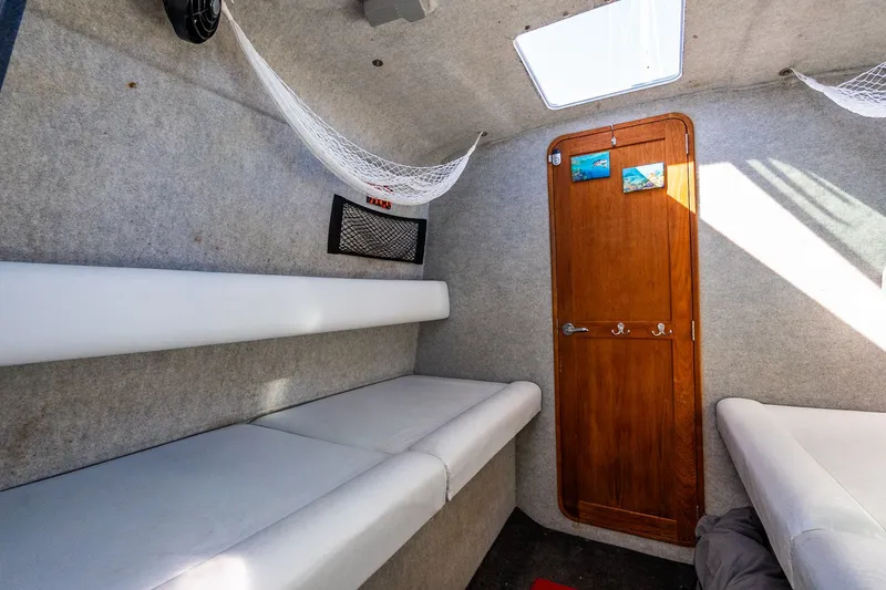 Slide: The Image of Interior of a 2008 Protector 410 Targa boat with sleeping area. - 29