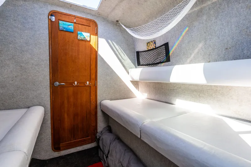 Slide: The Image of Interior of 2008 Protector 410 Targa with wooden door and white seating. - 30