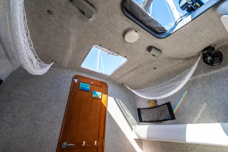 Slide: The Image of Interior of a 2008 Protector 410 Targa boat with nets and skylights. - 31