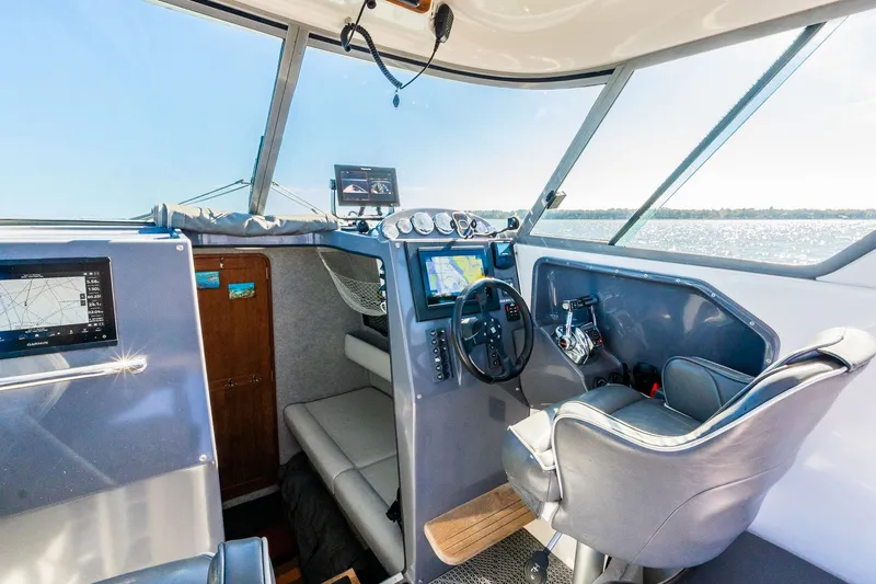 Slide: The Image of Interior of a 2008 Protector 410 Targa boat with modern navigation. - 41