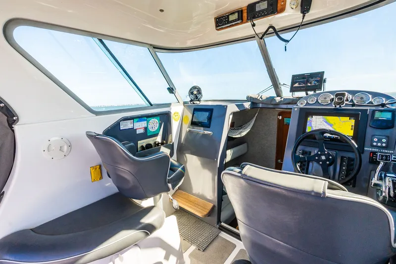 Slide: The Image of Interior of a 2008 Protector 410 Targa boat with modern navigation. - 43