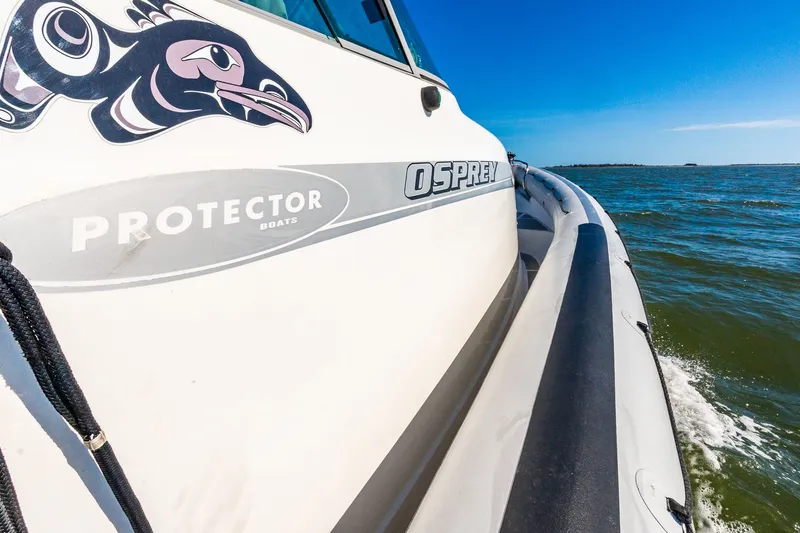 Slide: The Image of Protector 410 Targa boat on water, side view, 2008 model. - 48