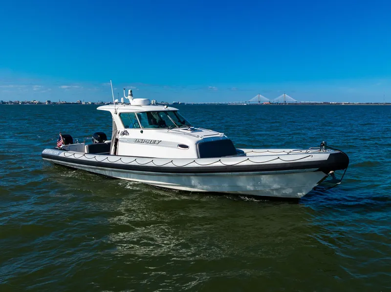 Slide: The Image of 2008 Protector 410 Targa boat on open water. - 7