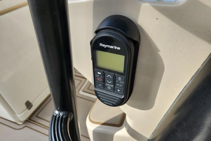 Slide: The Image of Raymarine control panel on 2022 Boston Whaler 330 Outrage boat dashboard. - 13