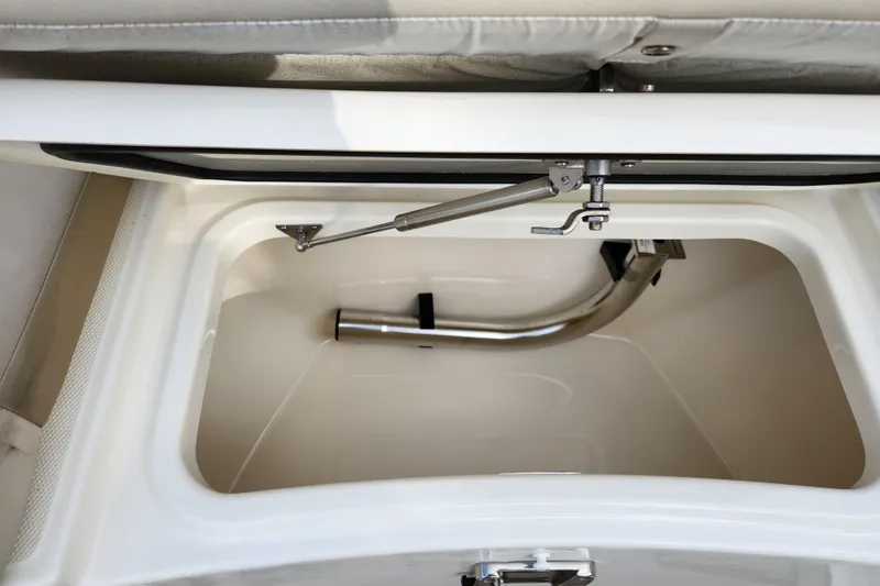 Slide: The Image of Storage compartment of 2022 Boston Whaler 330 Outrage boat, featuring stainless steel hardware. - 20