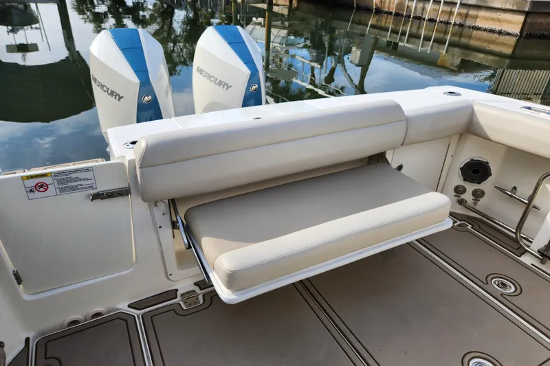 Slide: The Image of 2022 Boston Whaler 330 Outrage boat with foldable seating and twin Mercury engines. - 41