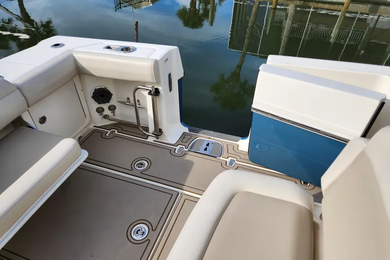 Slide: The Image of 2022 Boston Whaler 330 Outrage boat interior with seating and deck details. - 42