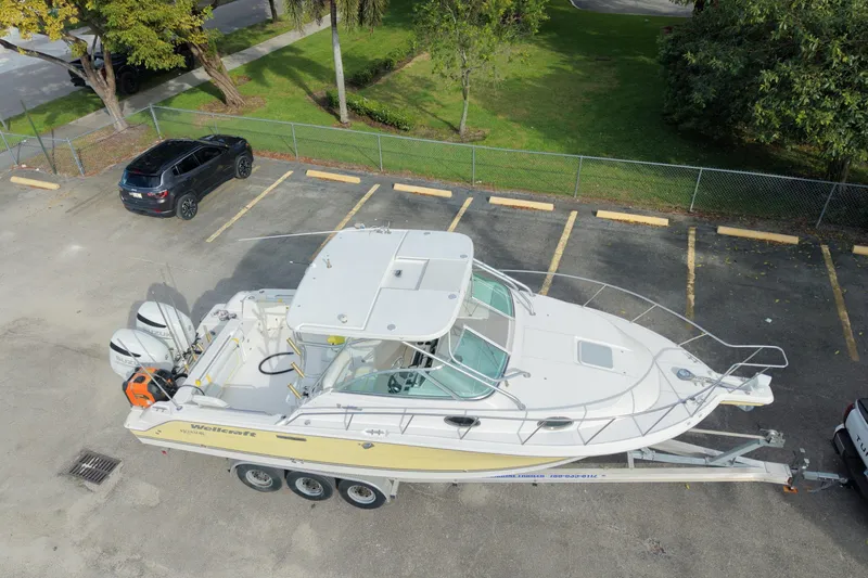 Slide: The Image of 2005 Wellcraft 290 Coastal boat on trailer in parking lot, aerial view. - 5