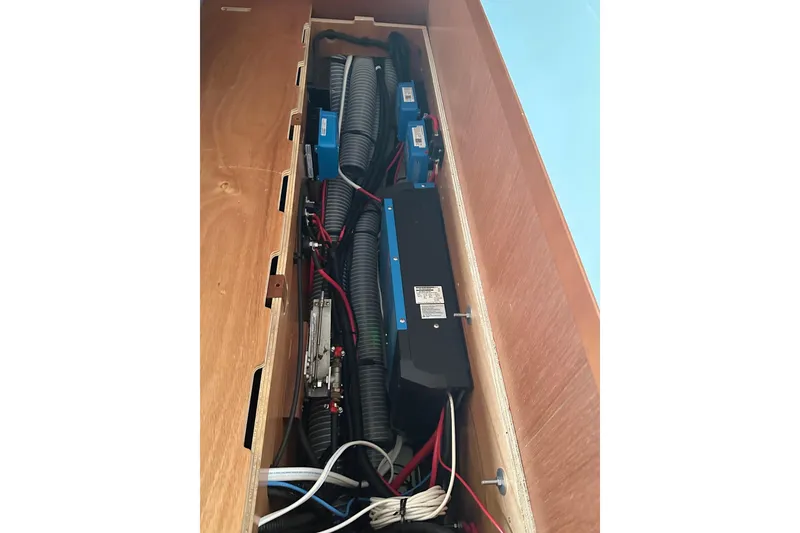 Slide: The Image of Electrical system inside a 2014 Beneteau Oceanis 48 yacht, featuring wiring and components. - 16