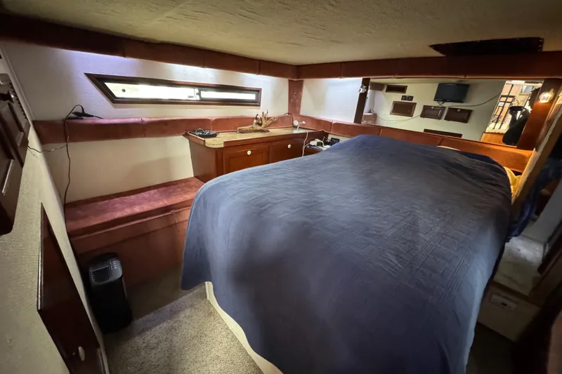 Slide: The Image of Interior cabin of 1982 Bayliner 4050 Bodega with bed and storage. - 12