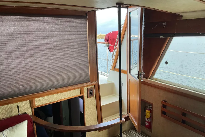 Slide: The Image of Interior view of 1982 Bayliner 4050 Bodega yacht with open door to deck. - 17