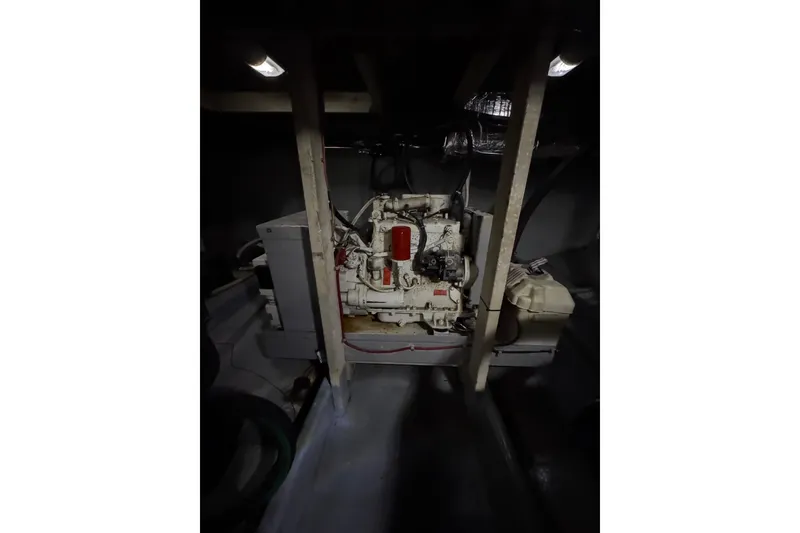 Slide: The Image of Engine room of 1982 Bayliner 4050 Bodega boat, featuring mechanical components. - 32
