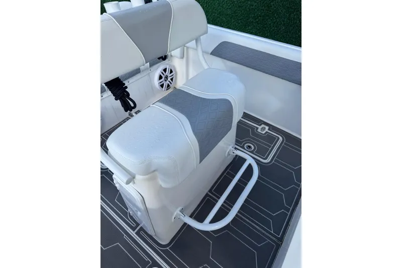 Slide: The Image of 2018 Carrera Powerboats 23 interior with cushioned seating and modern design. - 12