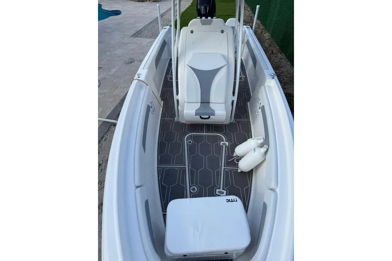 Slide: The Image of 2018 Carrera Powerboats 23 interior with sleek seating and modern flooring design. - 15