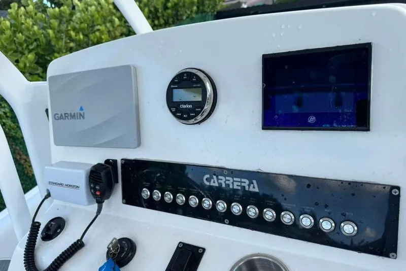 Slide: The Image of Dashboard of 2018 Carrera Powerboats 23 with Garmin and Clarion electronics. - 5