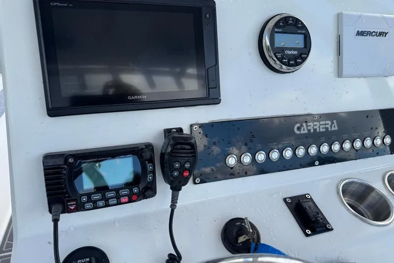Slide: The Image of Control panel of a 2018 Carrera Powerboats 23 with Garmin GPS and communication devices. - 7