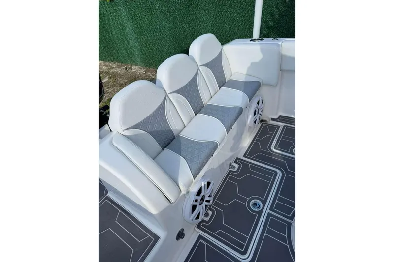 Slide: The Image of Luxurious seating on 2018 Carrera Powerboats 23 with stylish gray and white upholstery. - 9