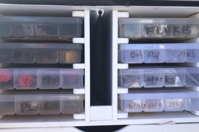 Slide: The Image of Interior cabin of 2017 Osprey 30 Fisherman boat with blue cushions. - 20