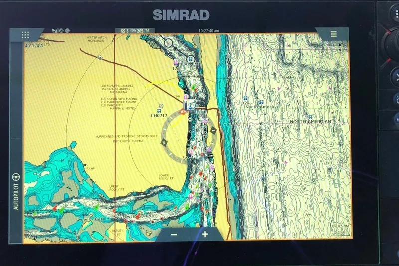 Slide: The Image of Simrad marine navigation display on 2017 Osprey 30 Fisherman boat, showing detailed coastal map. - 7