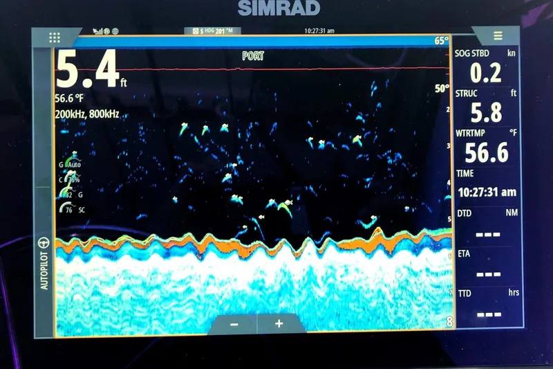 Slide: The Image of Simrad fishfinder display on 2017 Osprey 30 Fisherman, showing depth and water temperature. - 8