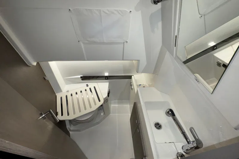 Slide: The Image of 2025 Jeanneau NC 895 Sport Series 2 bathroom interior with modern fixtures and compact design. - 17
