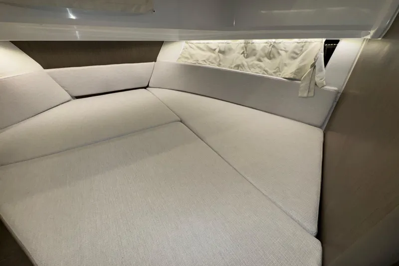 Slide: The Image of 2025 Jeanneau NC 895 Sport Series 2 interior cabin with beige upholstery. - 19