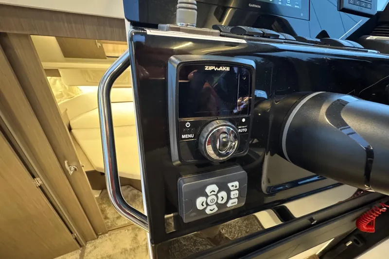 Slide: The Image of Control panel of 2025 Jeanneau NC 895 Sport Series 2 boat, featuring Zipwake system. - 26