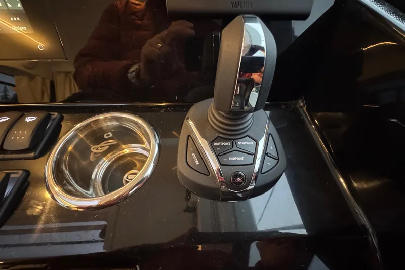 Slide: The Image of Control panel of 2025 Jeanneau NC 895 Sport Series 2 boat with joystick and buttons. - 27