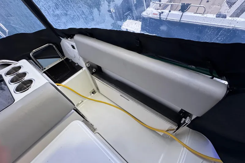 Slide: The Image of Interior view of 2025 Jeanneau NC 895 Sport Series 2 boat, featuring seating and cup holders. - 38