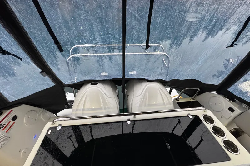 Slide: The Image of 2025 Jeanneau NC 895 Sport Series 2 cockpit with rain-covered windows. - 39