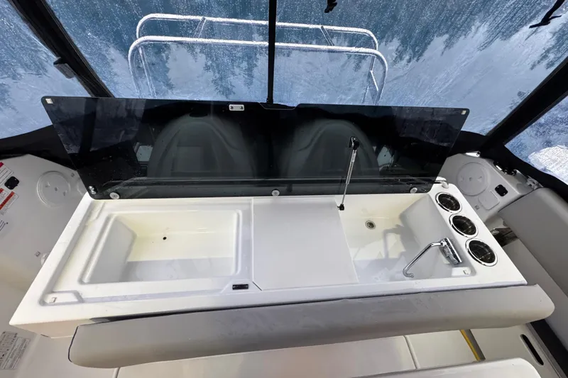 Slide: The Image of Interior view of 2025 Jeanneau NC 895 Sport Series 2 boat, featuring a sleek sink area. - 40