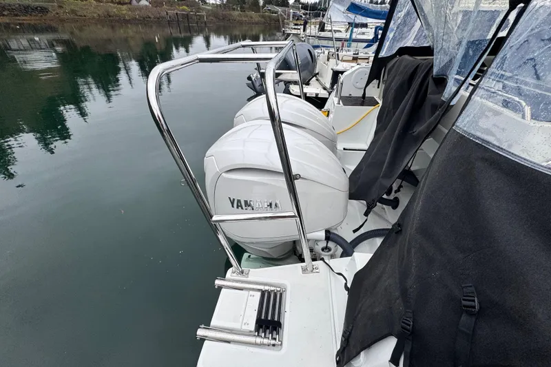 Slide: The Image of 2025 Jeanneau NC 895 Sport Series 2 with Yamaha outboard engines docked. - 44