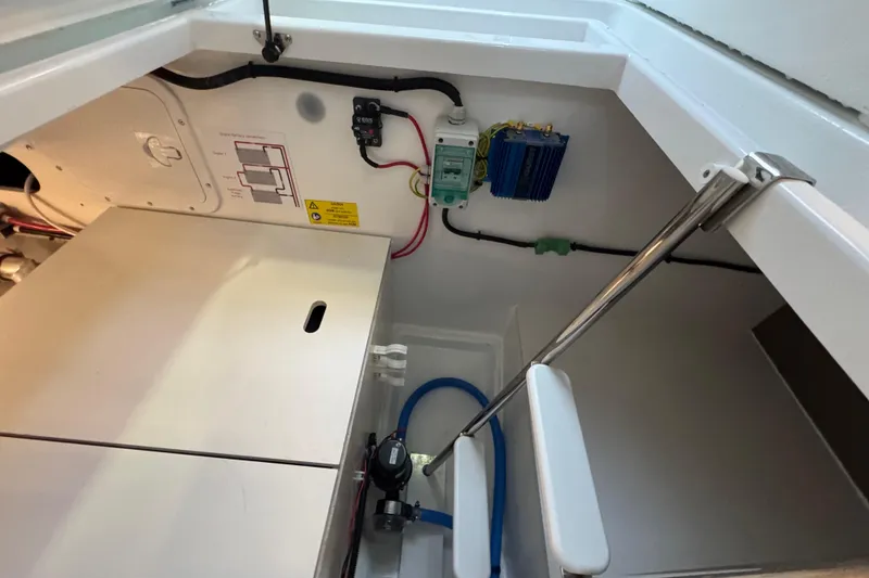 Slide: The Image of Engine compartment of 2025 Jeanneau NC 895 Sport Series 2 boat, showcasing wiring and components. - 46
