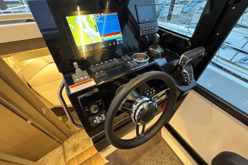 Slide: The Image of Helm of 2025 Jeanneau NC 895 Sport Series 2 with advanced navigation system. - 5