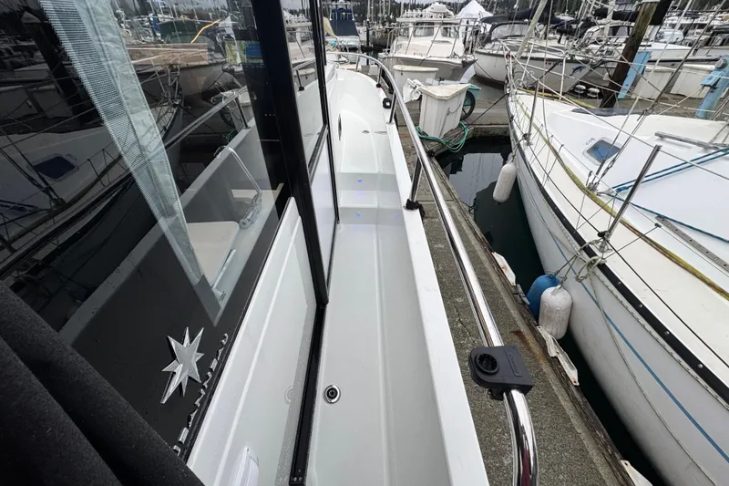 Slide: The Image of 2025 Jeanneau NC 895 Sport Series 2 docked, showcasing sleek design and modern features. - 50