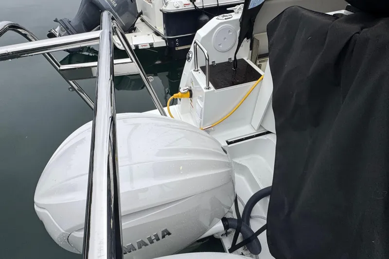 Slide: The Image of 2025 Jeanneau NC 895 Sport Series 2 with Yamaha outboard motor at dock. - 51