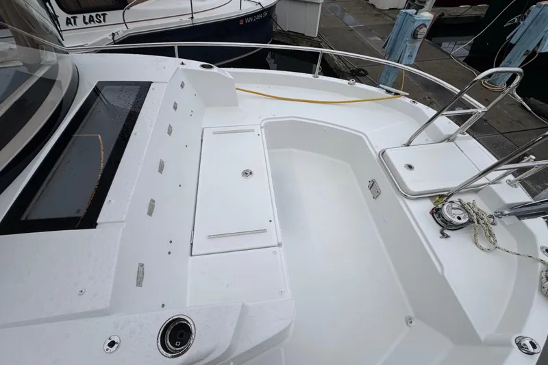 Slide: The Image of 2025 Jeanneau NC 895 Sport Series 2 boat deck with seating and railing. - 52