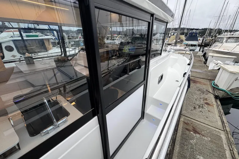 Slide: The Image of 2025 Jeanneau NC 895 Sport Series 2 docked at marina, side view. - 54