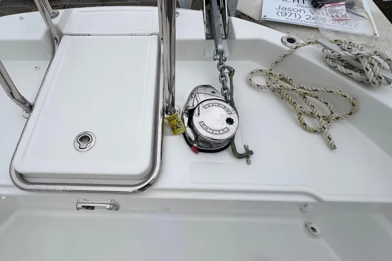 Slide: The Image of 2025 Jeanneau NC 895 Sport Series 2 boat deck with anchor winch and rope. - 57