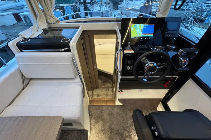 Slide: The Image of Interior of 2025 Jeanneau NC 895 Sport Series 2 boat with modern helm and seating. - 6