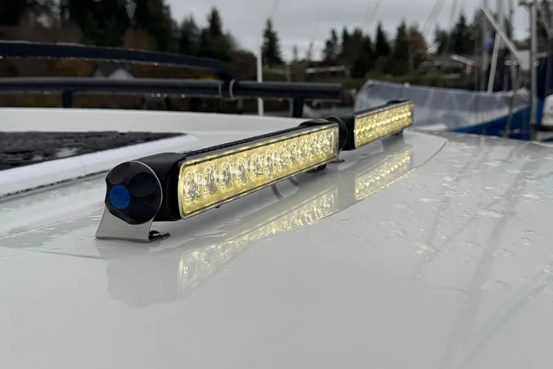 Slide: The Image of LED lights on Jeanneau NC 895 Sport Series 2 boat, 2025 model, with raindrops on surface. - 66