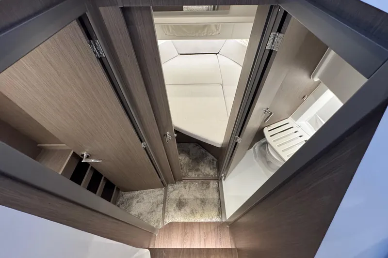 Slide: The Image of Interior view of 2025 Jeanneau NC 895 Sport Series 2, featuring cabin and bathroom. - 8