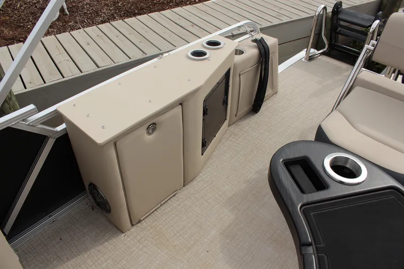 Slide: The Image of 2026 Tahoe Pontoon LTZ interior with seating, storage, and cup holders. - 10