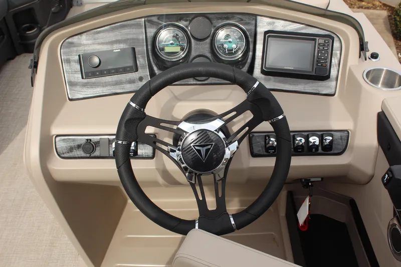 Slide: The Image of 2026 Tahoe Pontoon LTZ dashboard with steering wheel and control panel. - 14