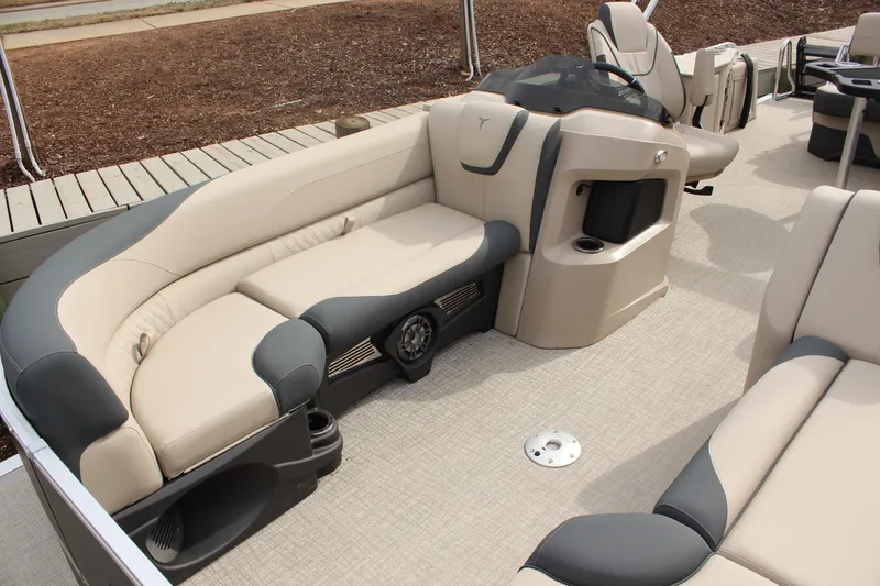 Slide: The Image of 2026 Tahoe Pontoon LTZ interior with beige and gray seating, showcasing luxury and comfort. - 17