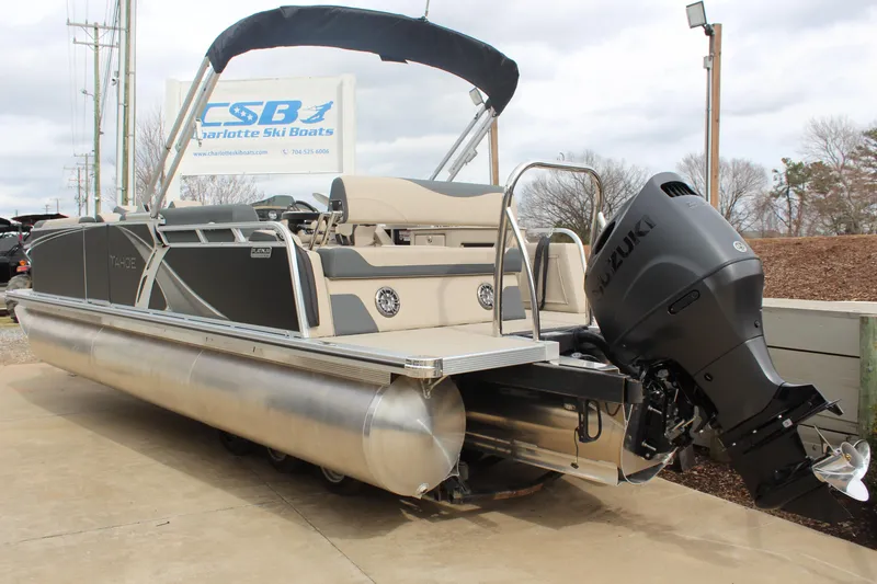 Slide: The Image of 2026 Tahoe Pontoon LTZ boat with Suzuki outboard motor at Charlotte Ski Boats. - 4