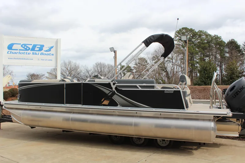 Slide: The Image of 2026 Tahoe Pontoon LTZ boat displayed at Charlotte Ski Boats dealership. - 5