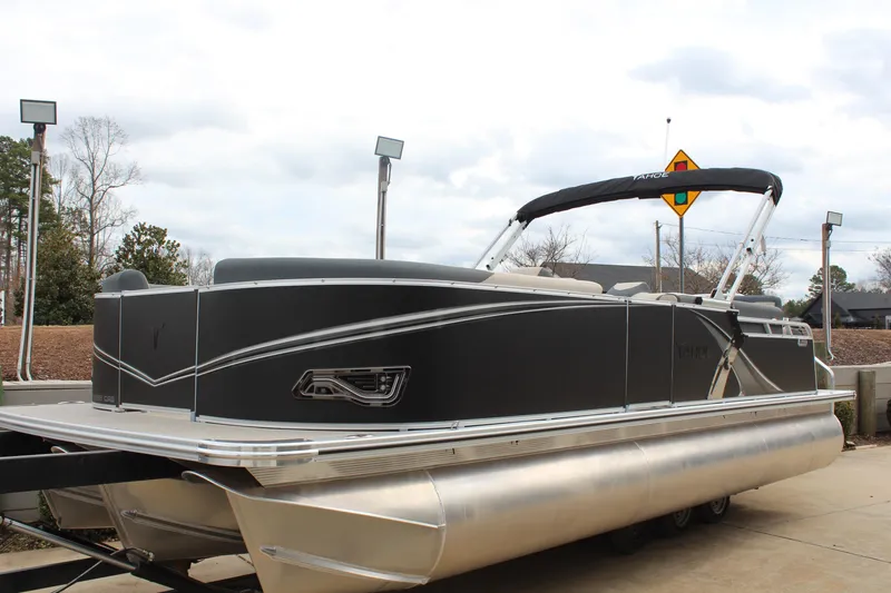 Slide: The Image of 2026 Tahoe Pontoon LTZ boat with sleek design on a trailer. - 6