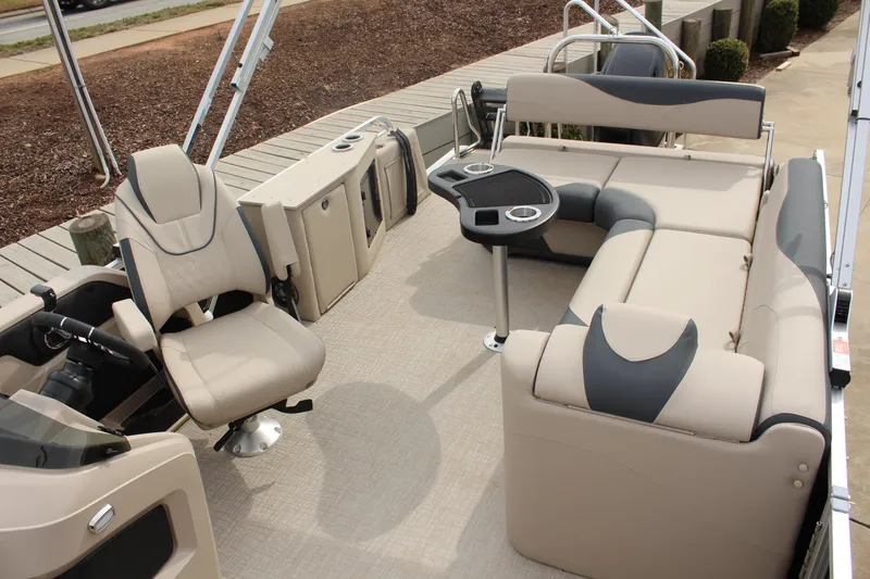 Slide: The Image of 2026 Tahoe Pontoon LTZ interior with beige seating and modern amenities. - 9